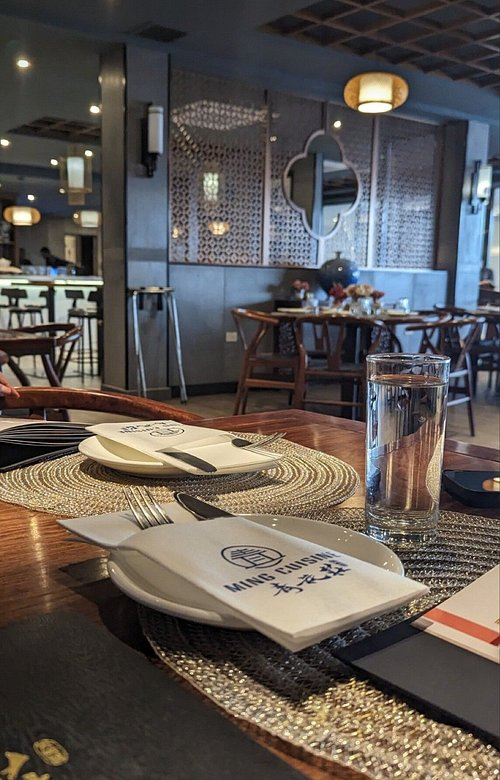 Table setting and dining room inside Ming Cuisine